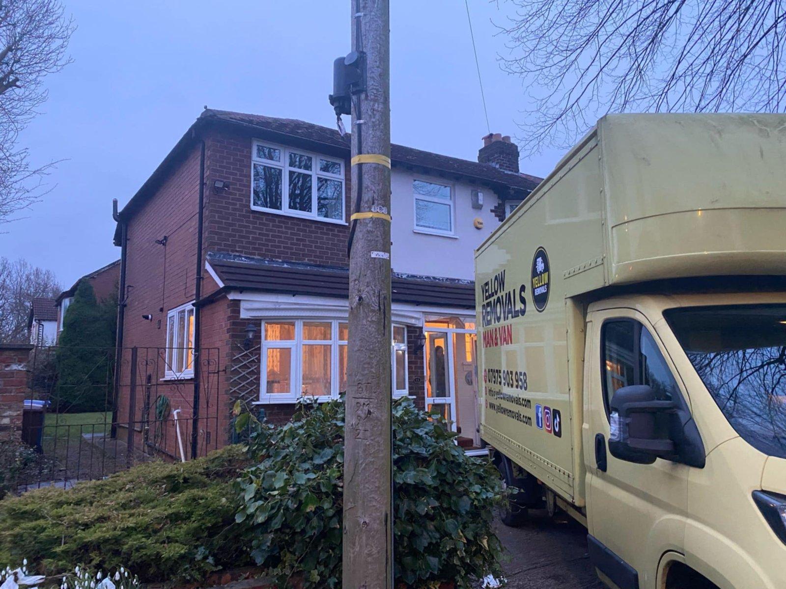 Yellow removals van on street